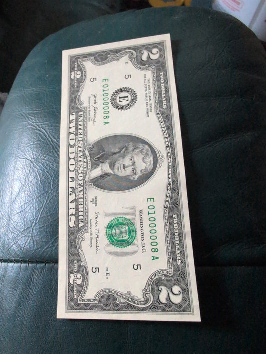 $2 Crisp UNC note with low Serial number and (6) 0s on it
