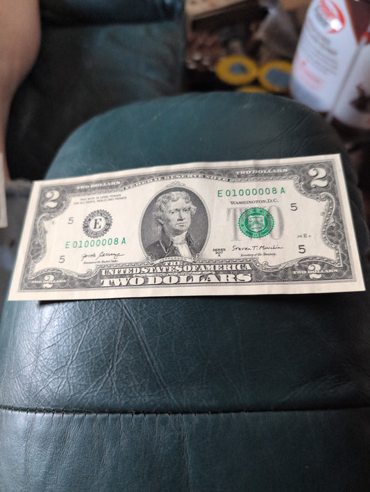 $2 Crisp UNC note with low Serial number and (6) 0s on it
